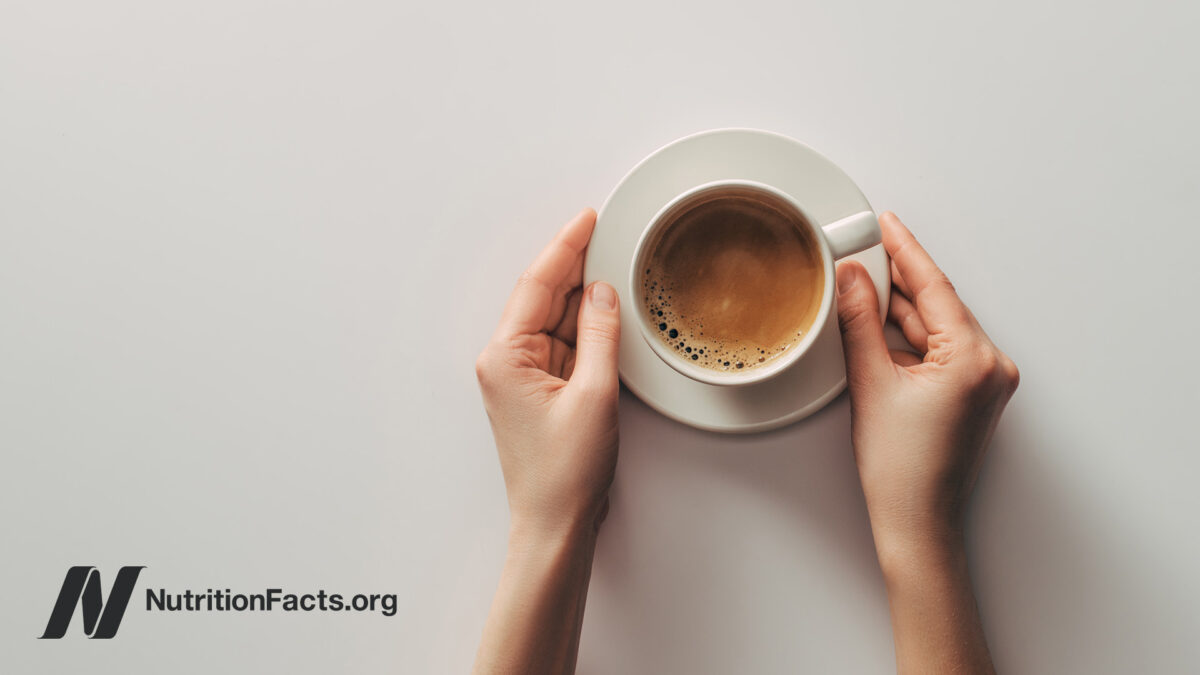 Woman holding a coffee cup