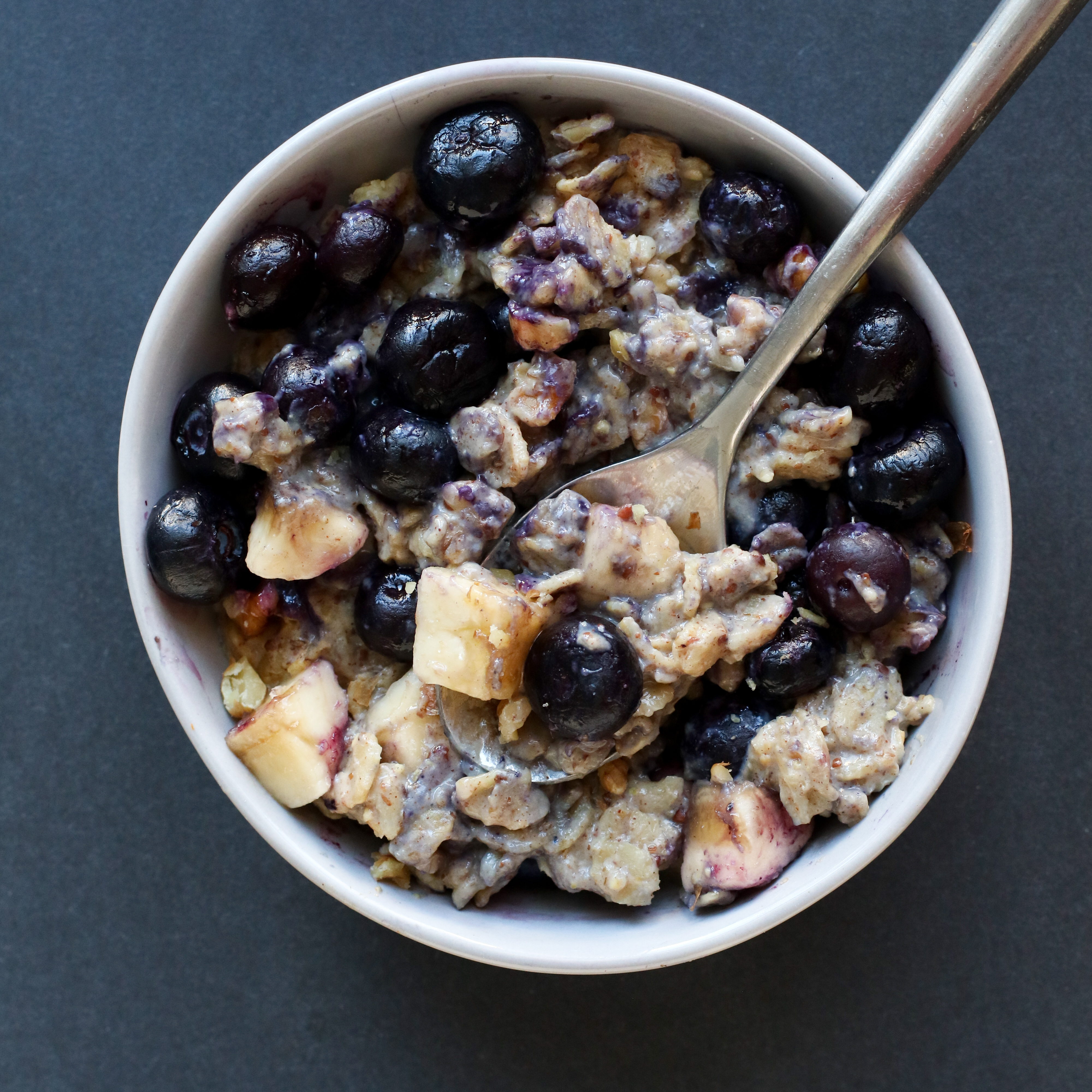 bowl of oats with banana and blueberries