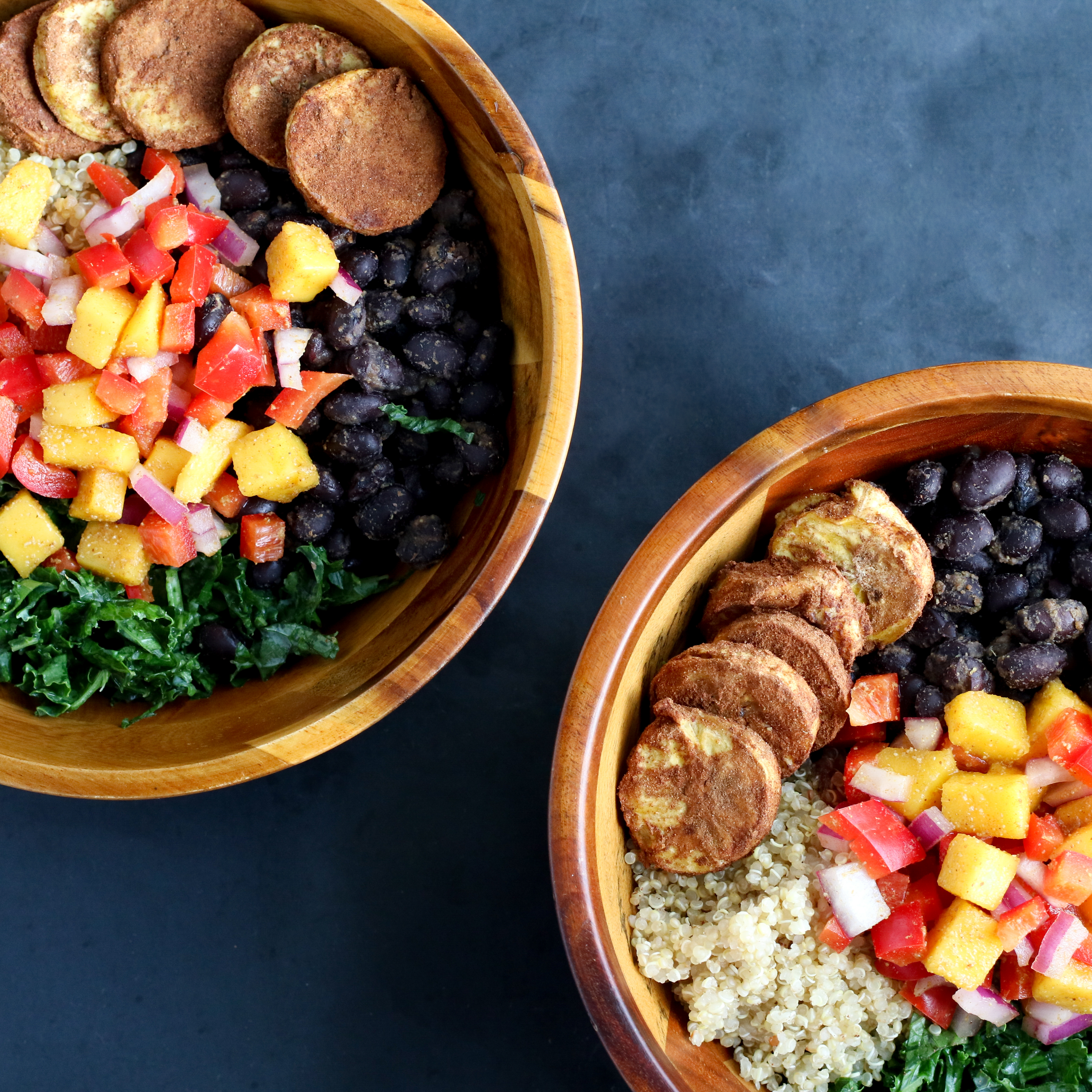 two bowls of grains, beans, vegetables, and baked plantains