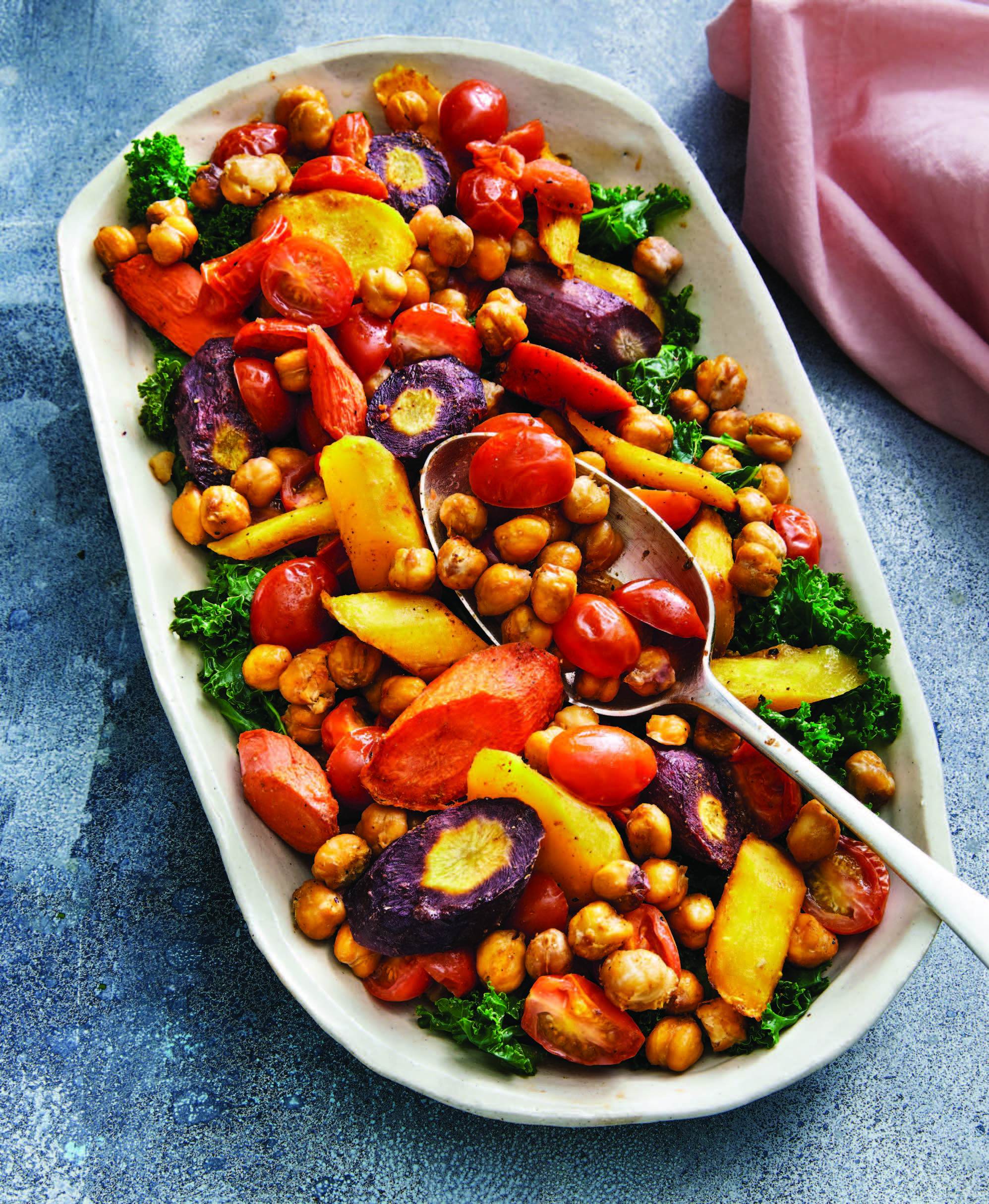 serving dish filled with roasted vegetables and chickpeas