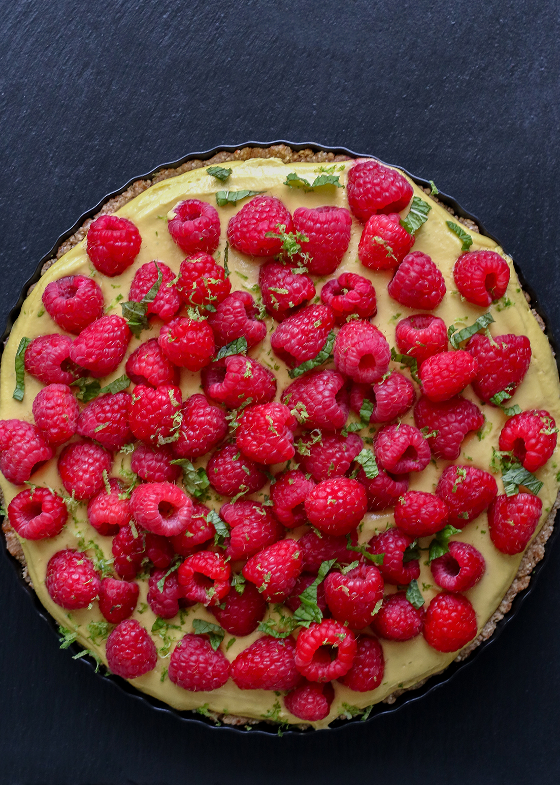 mango tart topped with raspberries