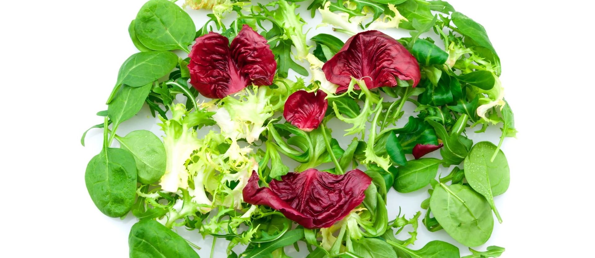 salad leaves laid out to resemble a smiling face