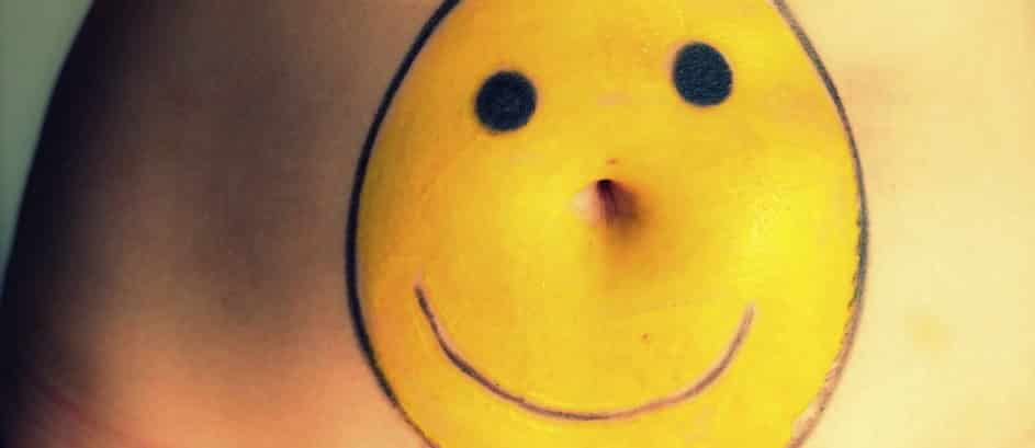smiley face drawing over a person's midsection
