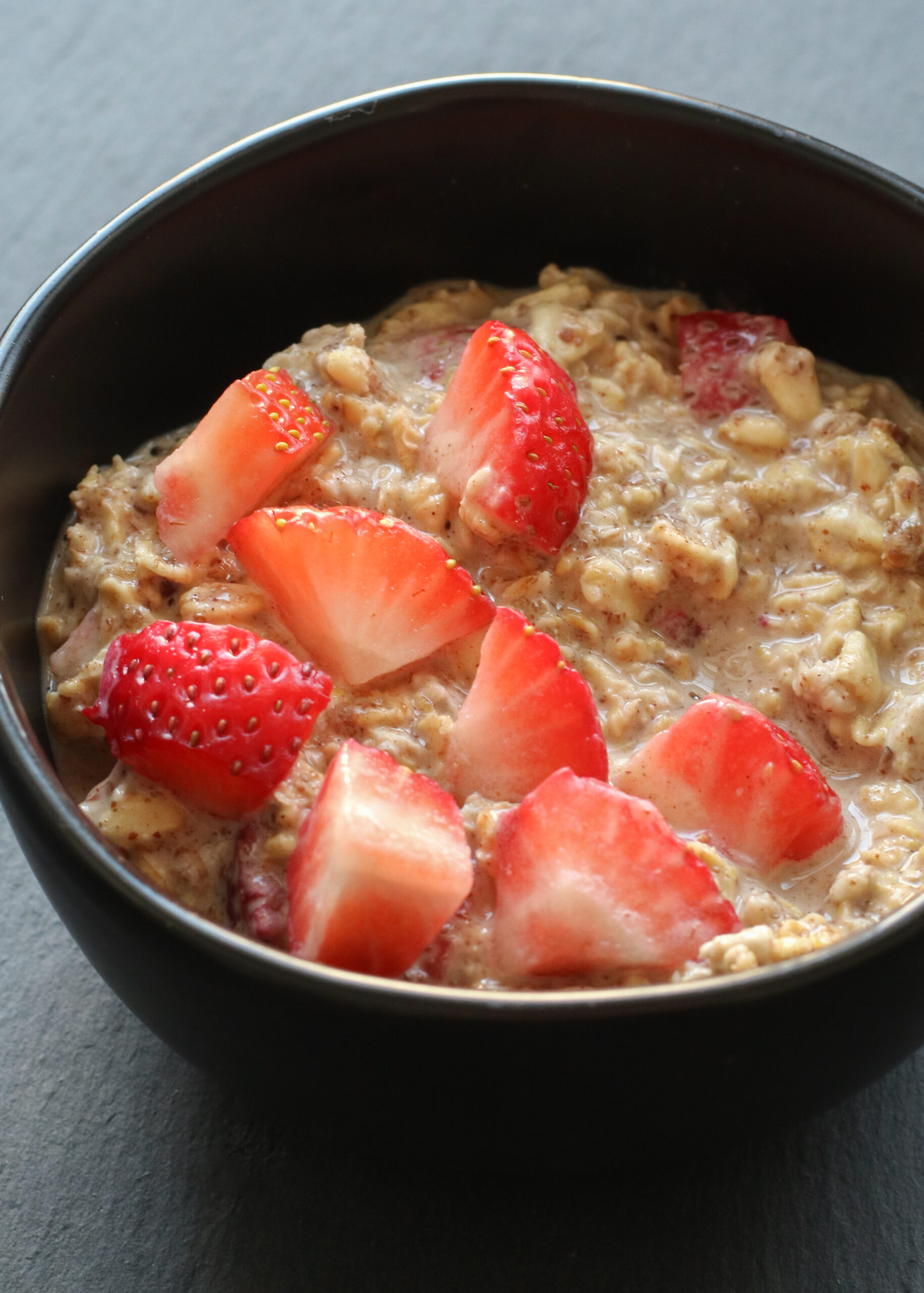 bowl of overnight oats topped with strawberries
