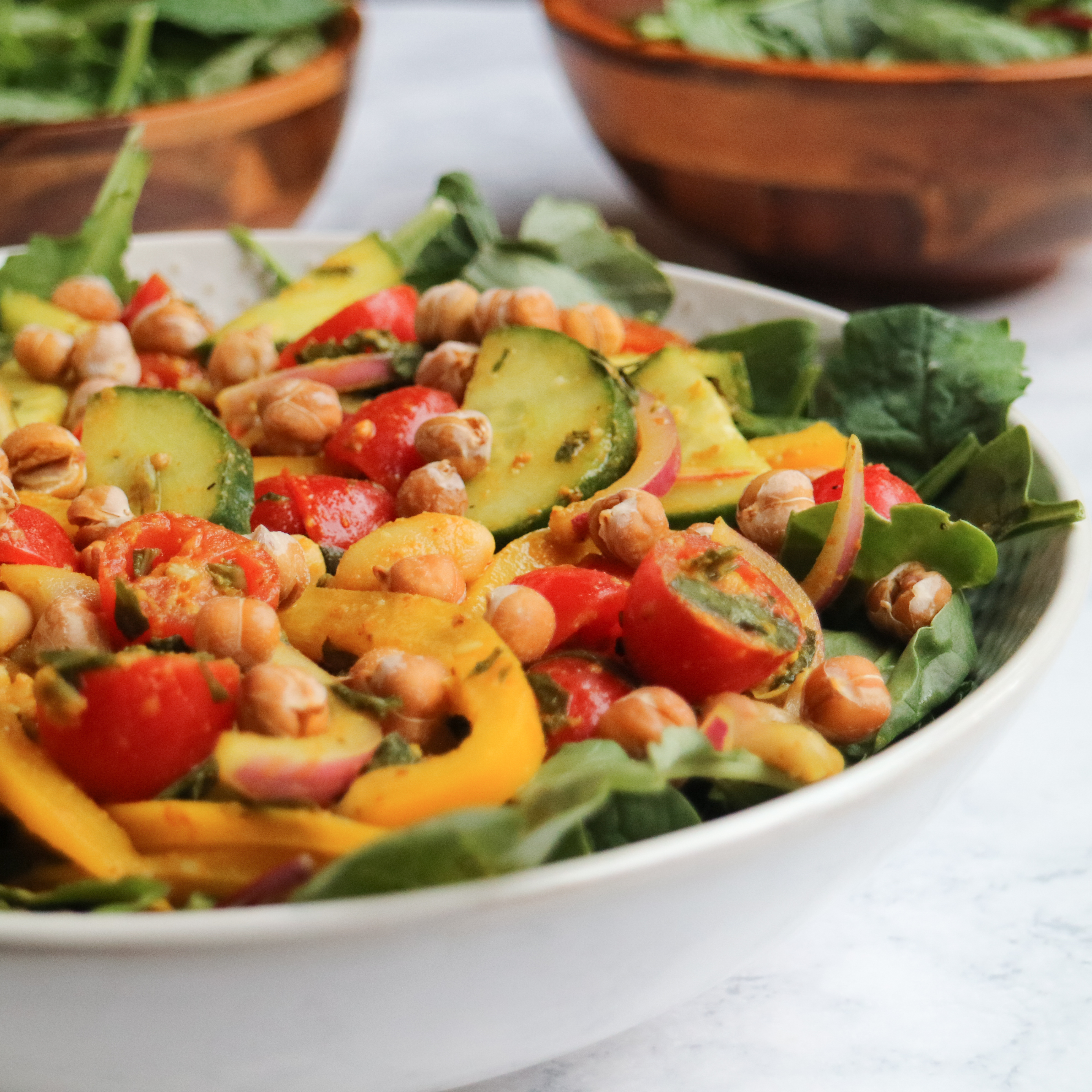 bowl of salad made of various vegetables and chickpeas