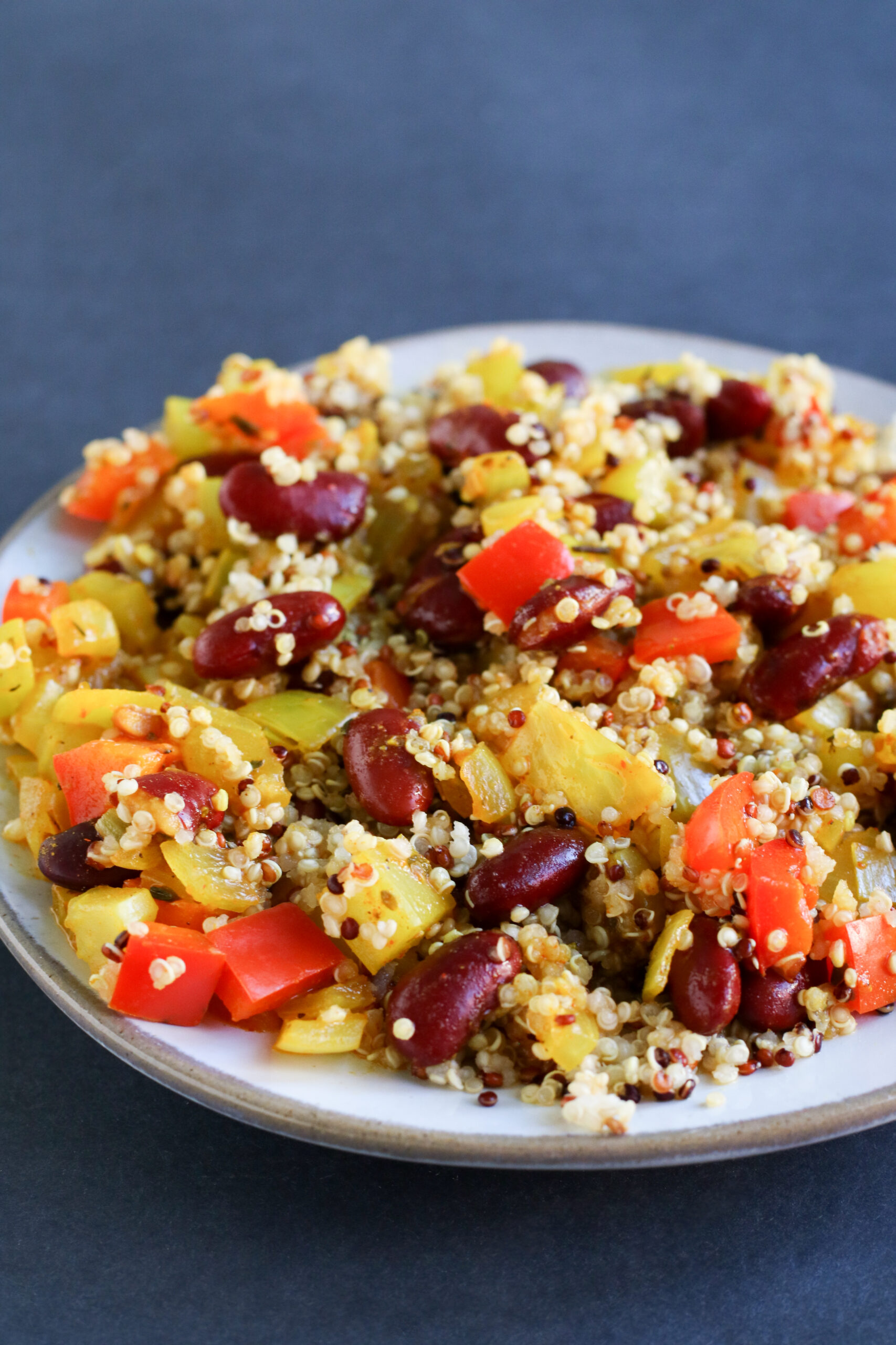 plate of quinoa with red beans and vegetables