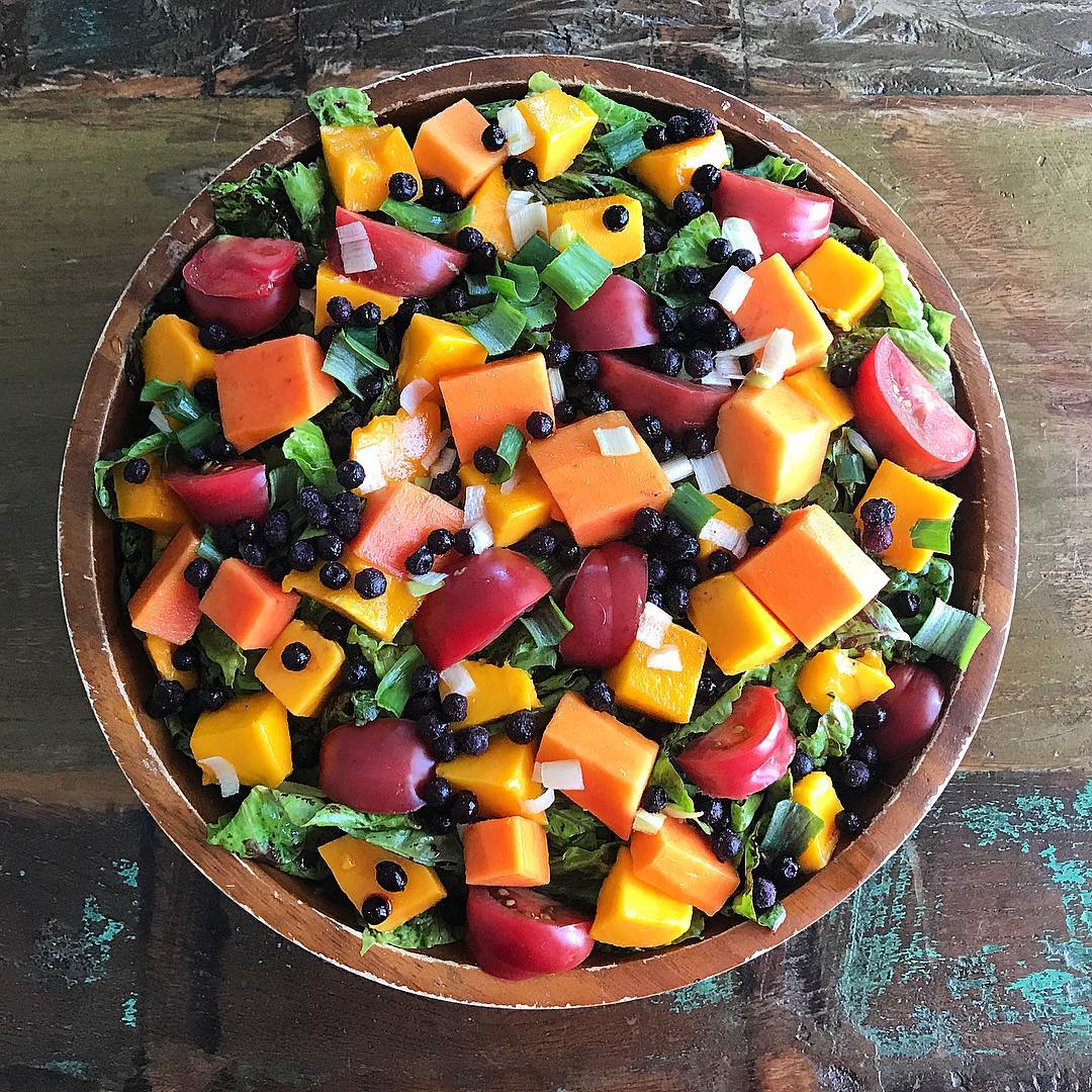 serving bowl of salad made of various fruit and vegetables