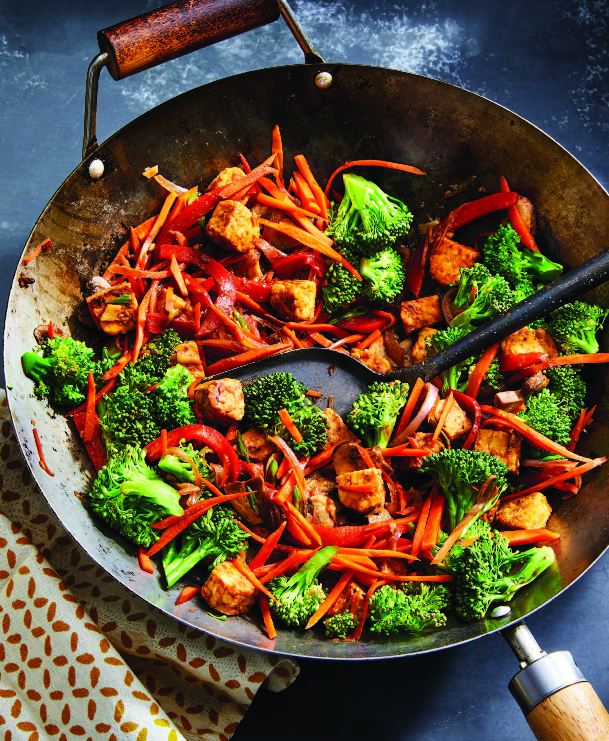 wok filled with tempeh and vegetables