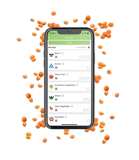 Phone with Daily Dozen app surrounded by beans